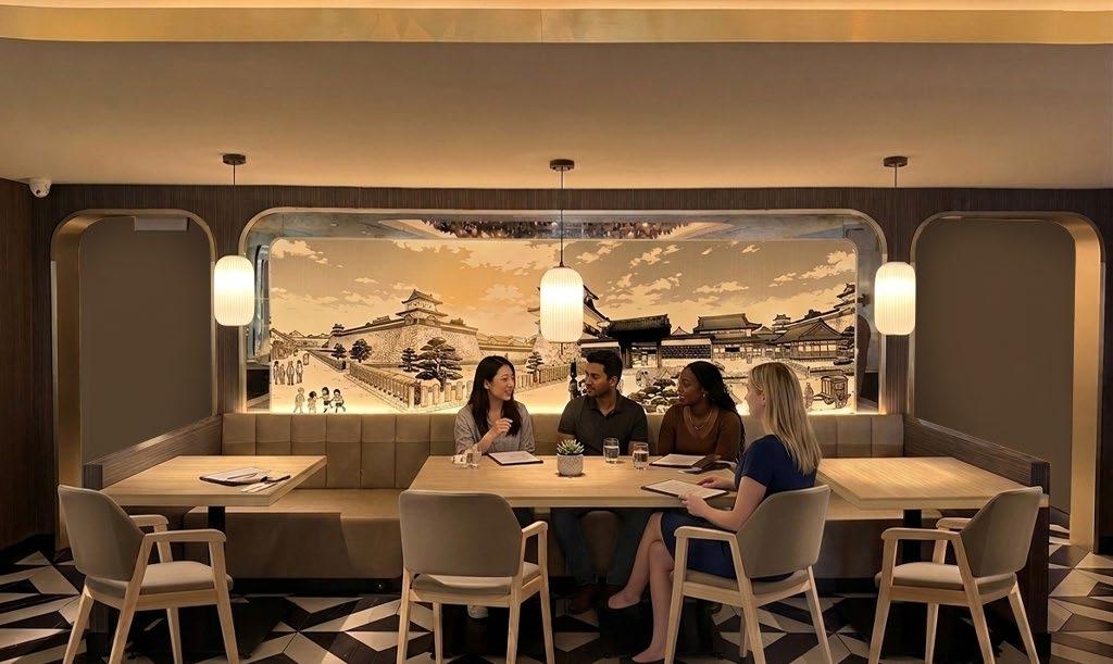Four guests at a long booth beneath paper lanterns and a hand-drawn castle mural